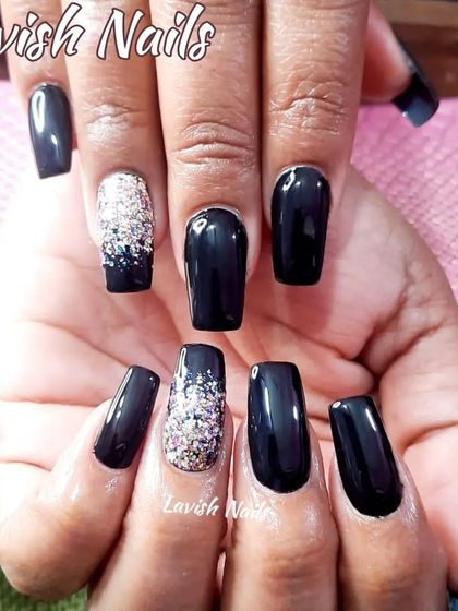 Classic black square nails with two accent nails featuring a dense silver glitter fade.