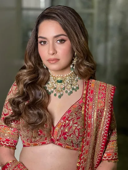 A close up on this bride's classic glamour. The focus is on her expressive eyes, enhanced with a soft wing and full lashes, and a perfectly matched foundation that looks like second skin.