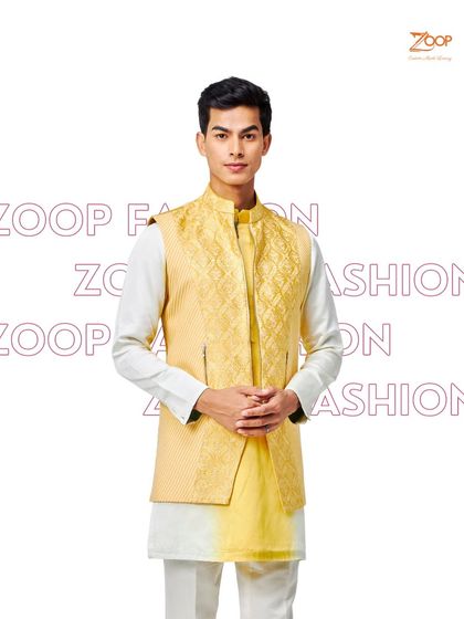 A classic Haldi look. This yellow textured Nehru jacket paired with a gradient yellow and white kurta is a meticulously crafted garment for the discerning gentleman.