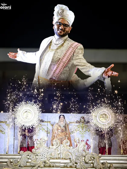 A creative double exposure shot of the groom during his grand entrance, combined with a view of the stage and fireworks. This is my cinematic style in action.