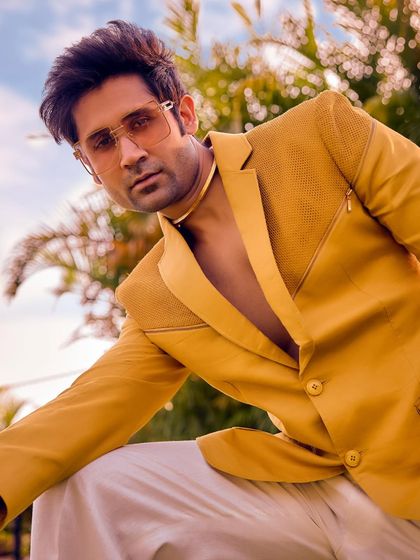 Not just yellow, it's a mood. This close-up of the Sukoon blazer shows the textured fabric and sharp cut, crafted for daylight festivities and elegant statements.