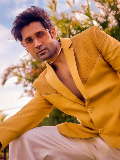 A close-up of the yellow Sukoon blazer, highlighting its textured fabric and modern design. This piece is not just yellow; it's a mood, a moment, and pure magic for daylight festivities.