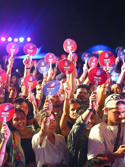 The crowd decides the winner. A sea of red and blue cards at the Red Bull Delhi Regional, with everyone completely tuned into the battles.