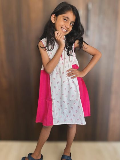 Cherishing these little moments forever. This pink and white dress is perfect for little fashionistas who are ruling our hearts.