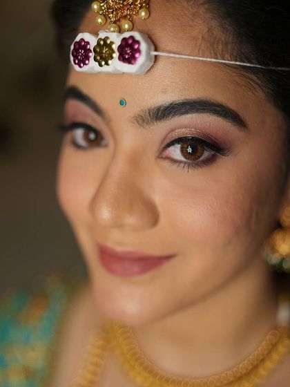 A single, stunning photo is sometimes all you need. This close-up showcases the soft, romantic eye makeup and flawless skin for this South Indian bridal look.