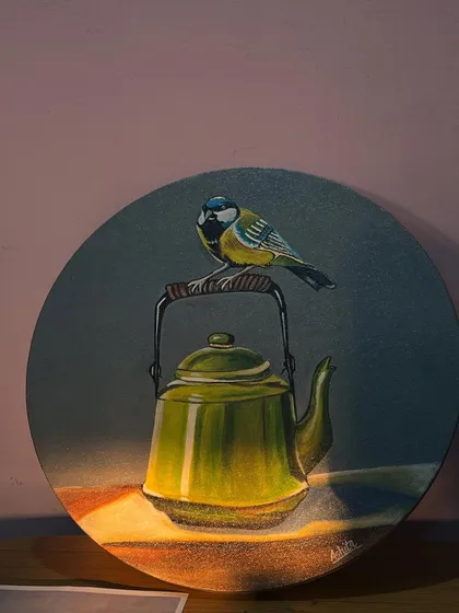 I find magic in everyday objects, like this classic green teapot. Adding a little bird perched on the handle gives this still life painting a touch of whimsy and storytelling on a round canvas.