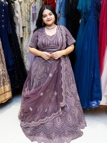 A full-length view of the violet lehenga, showing how it looks in my store, ready for you to try on.