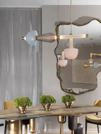 A detail shot of the Luna Kaleido fixture, showing the soft blue and pink glass beads. The design offers infinite interpretations and can be tailored to any client's vision.