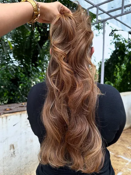 Her crowning glory. This stunning 'Butter Blonde' is warm, bright, and full of dimension. I used a balayage technique to create a natural, sun-kissed effect.