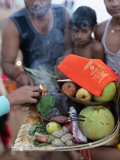 A close-up of offerings being prepared for Chhath Puja, showing the fresh fruits and other items that will be presented to the Sun God.