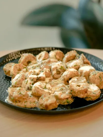 A platter of my creamy chicken and herb rolls, sliced and ready to serve. This is an elegant appetizer that is perfect for sophisticated events.
