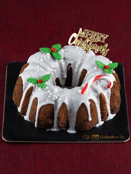 Our Glazed Plum Cake is a beautiful centerpiece for your Christmas table. It's a traditional rum-soaked plum cake with a sweet white glaze.