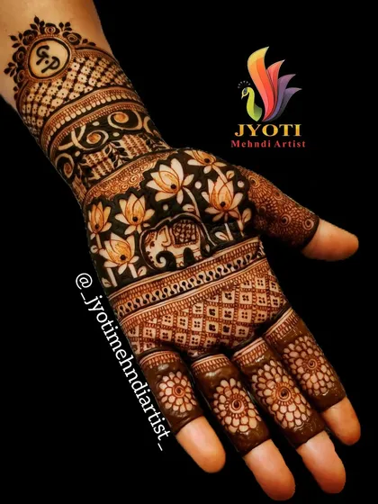 A full-coverage design featuring elephants and lotus flowers. The initials of the couple are subtly integrated into a circular motif on the wristband.