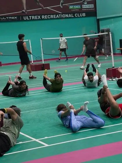 The work doesn't end when the last shuttle drops. A proper cool-down with deep stretching is crucial for mobility, recovery, and preventing injuries. Here's the tribe stretching together.