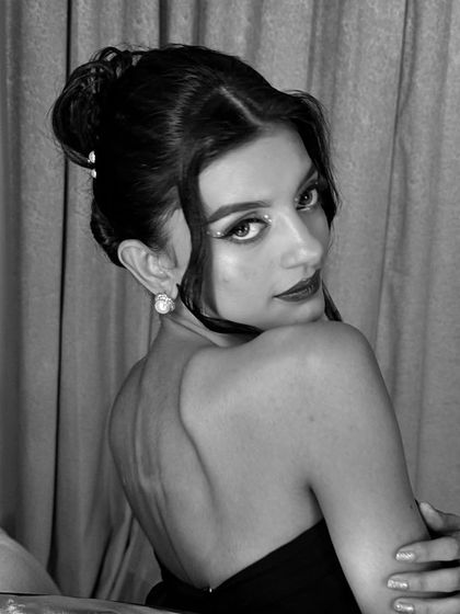 A timeless black and white portrait. This shows how a well-structured makeup look translates beautifully into monochrome photography.