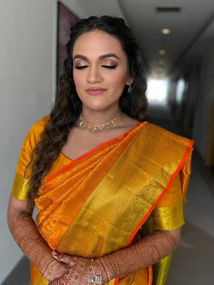 A close up with eyes closed, showing the soft blending of the eyeshadow. We use warm, earthy tones to create a look that is both natural and defined.