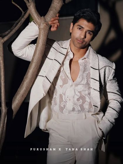 Caught in a moment of quiet power. Taha Shah in this white beaded suit shows that true royalty is not announced, it is recognized.