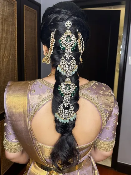 It's all in the details. This shot showcases an intricate traditional bridal braid, a key element of the complete South Indian bridal look I help create with my team.