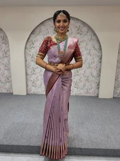 A happy and confident smile says it all. The saree is draped to be comfortable and secure, allowing the model to feel at ease while looking her absolute best.