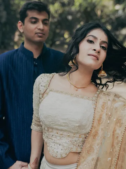 An engagement shoot is about capturing love. The makeup here is soft and romantic, designed to enhance her natural glow as she shares a moment with her forever love.