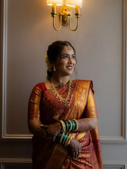 A portrait of our South Indian bride looking absolutely regal. The makeup is subtle yet defining, focusing on flawless skin and expressive eyes.