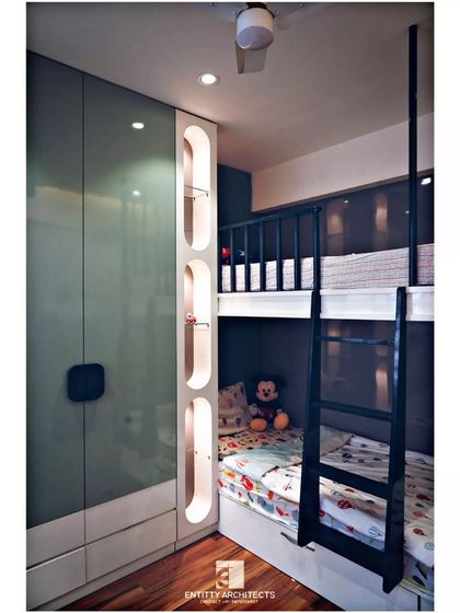 Another angle of the kids' room, highlighting the space-saving bunk bed design. The glossy grey accent wall behind the bed adds depth, while the wooden flooring brings warmth to the room.