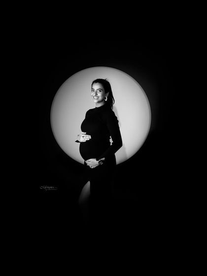 Creating art from love, light, and life. The spotlight effect in this monochrome shot creates a dramatic and memorable portrait.