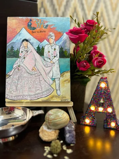 Another angle of the custom wedding canvas, styled beautifully in the client's home. The painting captures their fairytale moment against a mountain backdrop.