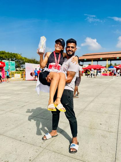 Being lifted by my coach after a successful 30k race. This moment captures the joy and partnership that comes with a great coach-athlete relationship.