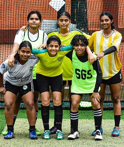 Different players, one heartbeat. A pre-game huddle showing the focus and unity of our girls' team.