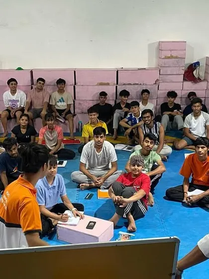 An interactive moment during our rules and regulations workshop, where a young athlete asks a question.