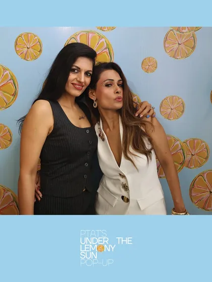Two stylish attendees at the PTAT pop-up. Our photos capture the fashion and flair of the people at your event.
