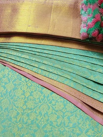 A client's sea-green silk saree, pre-pleated and ready for a party. The fluffy pleats will give her a beautiful silhouette.