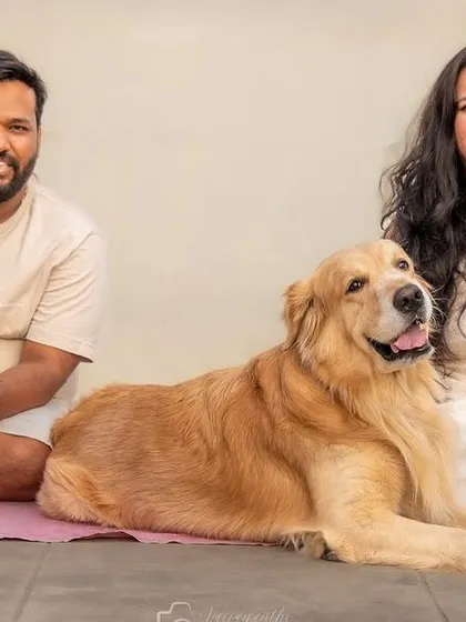 A beautiful family portrait with not one, not two, but three dogs! This photo with Avni, Vijay, and their furry pack shows a calm, happy, multi-pet family.