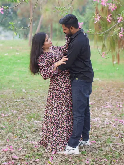 Capturing a candid, interactive moment between the couple during their outdoor pre-wedding session. These unposed shots show your genuine connection.