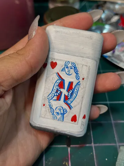 A work-in-progress shot of the Queen of Hearts lighter, showing the initial white base coat.