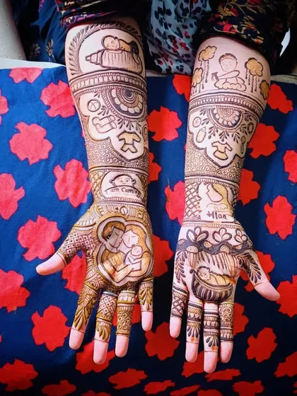 A very detailed and story-driven baby shower mehandi. It includes portraits of the family, a baby in a cradle, and even a little chef's hat motif.