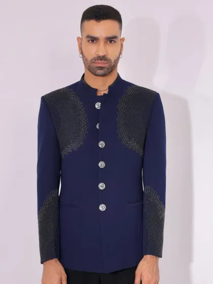 A close-up of the textured panels on the navy Jodhpuri.