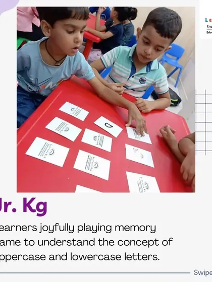 Teamwork makes learning even more fun! These Junior KG students are playing a memory game together, helping each other match uppercase and lowercase letters. This collaborative activity reinforces their learning while building social skills.