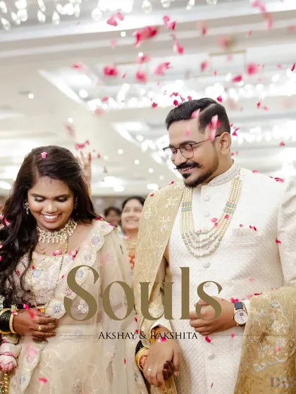 "Souls." A beautifully edited photo of the couple walking through a shower of petals, capturing the magic and happiness of their wedding day.