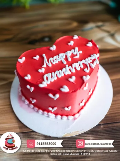 A simple and sweet red heart-shaped cake for an anniversary. The classic design and heartfelt message make it a timeless choice to celebrate your love.