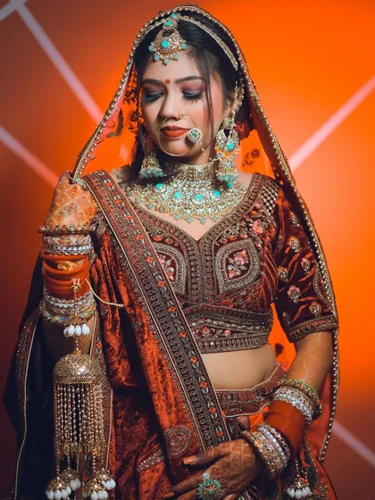 A portrait using creative orange backlighting to make the bride and her turquoise jewelry stand out.