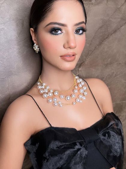 A closer look at this glamorous party makeup. The sharp, defined eyes and perfectly contoured features create a very polished and high-fashion look.