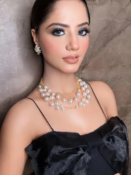 A closer look at this glamorous party makeup. The sharp, defined eyes and perfectly contoured features create a very polished and high-fashion look.