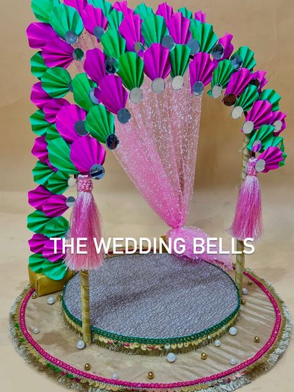 A closer look at our paper fan Ganesha mandap without the idol. The platform is covered in a sparkling silver fabric with a traditional border, ready for you to place your Bappa in his beautiful new home.