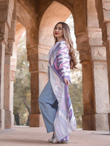 A slightly different angle that plays with the depth of field, keeping the model sharp while the background arches recede softly.