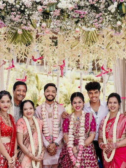 A beautiful family portrait with the couple and their loved ones at the engagement ceremony.