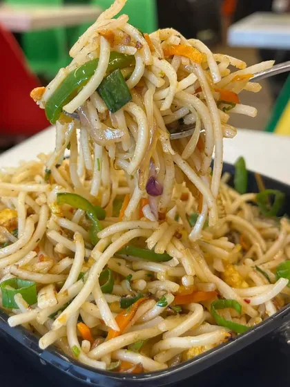 A tempting forkful of my Hakka Noodles, loaded with fresh vegetables. It's a simple yet delicious classic.