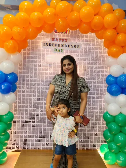 A mother and daughter capture a special moment at our Independence Day celebration. Our events are designed for families to enjoy quality time together.