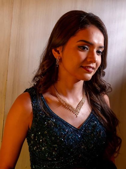 This portrait shot highlights the clean, precise application of the eye makeup and the smooth, airbrushed finish of the skin.